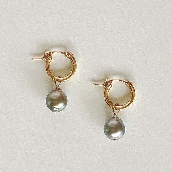 Tahitian pearls add-on understated glamour to huggie hoop earrings ideal for everyday.  1" drop, 3/8" width, 9mm pearls aprox. Removable pearl dangle 14kt Goldfill/Tahitian pearls Snap post enclosure